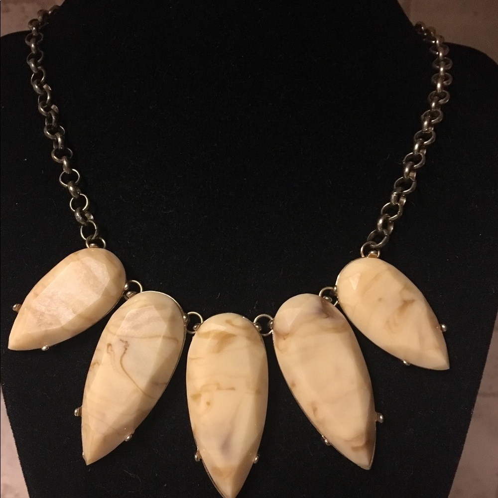 Teardrop stone necklace in goldtone setting.